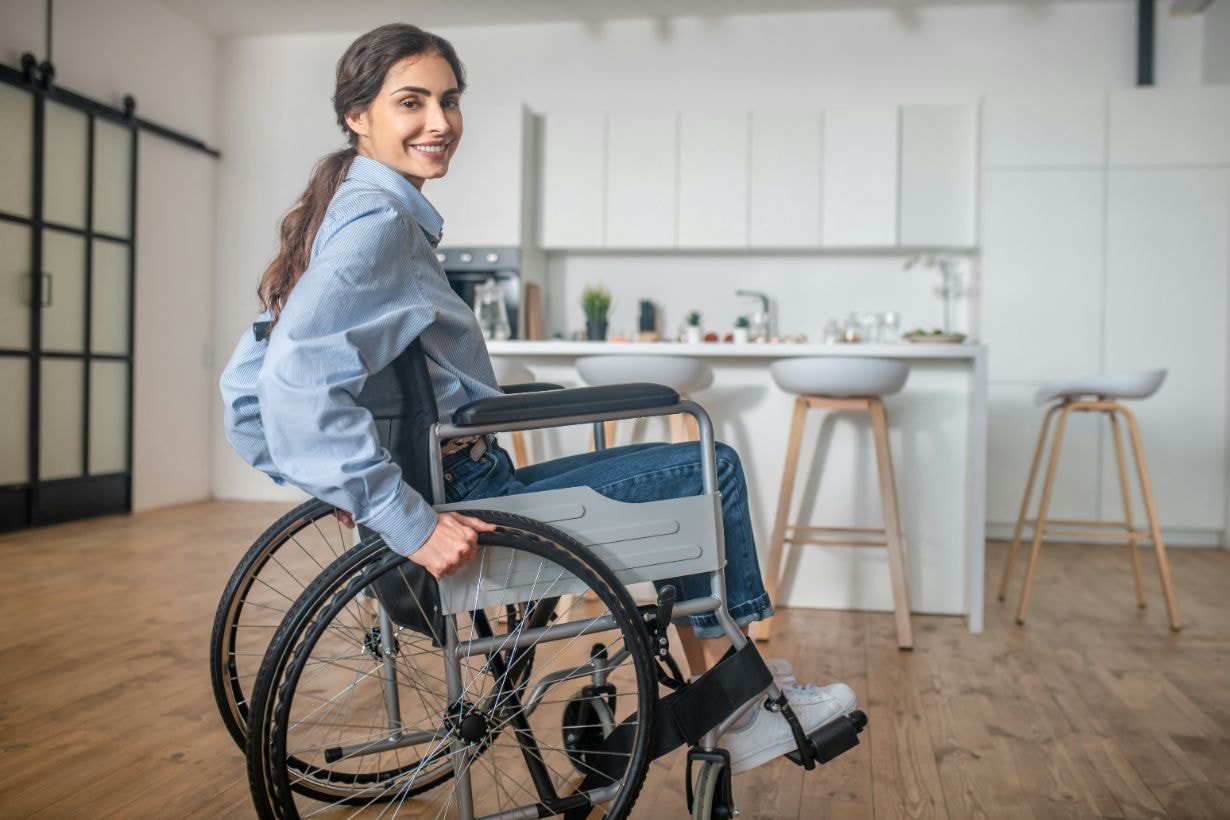 Lady in wheelchair at her home