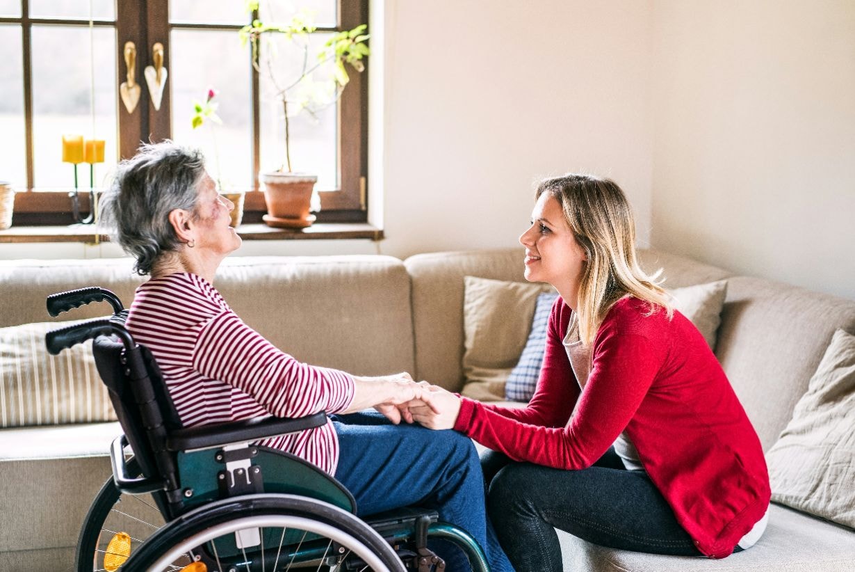 Old disabled lady with her carer