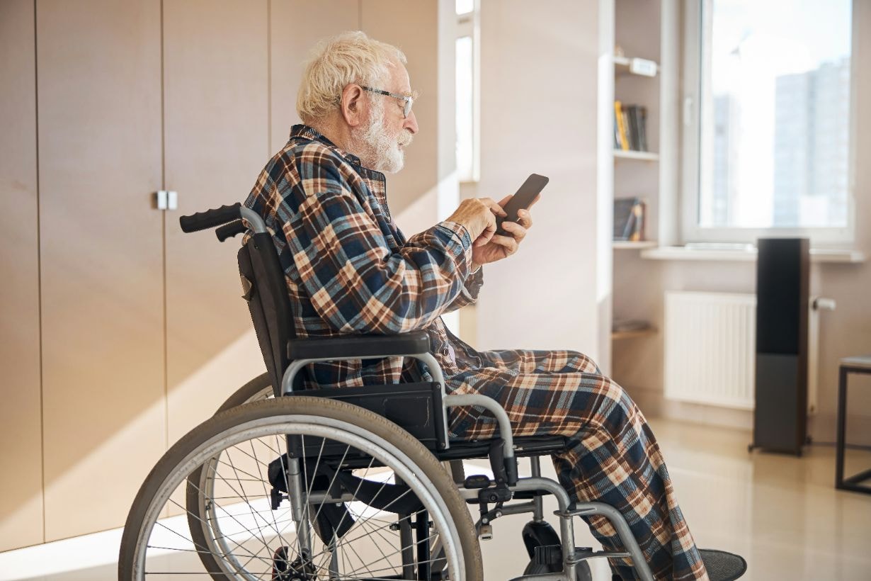 Disabled old man in his wheelchair