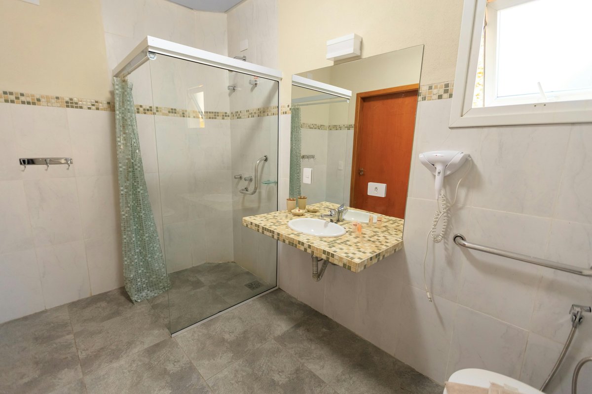 Accessible bathroom with spacious roll-in shower designed for wheelchair access in cerebral palsy housing Sydney