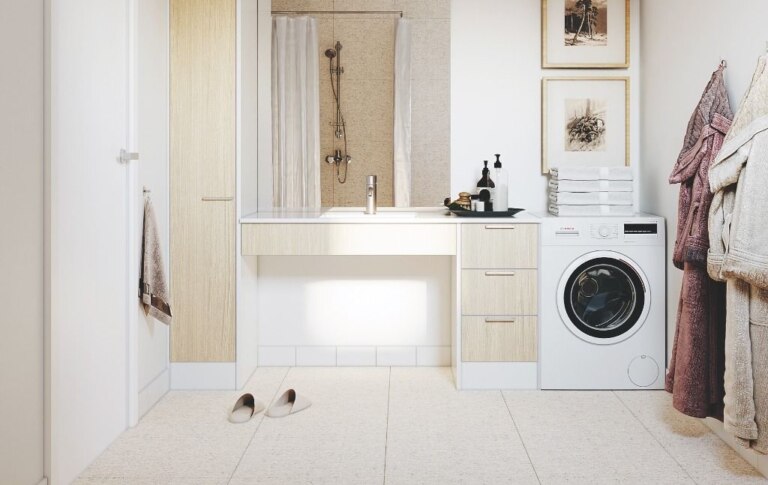 A laundry room in Pendle Hill, NSW with a washer and dryer.