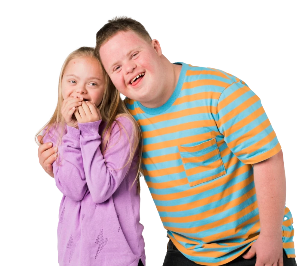 A boy and a girl posing for a photo.