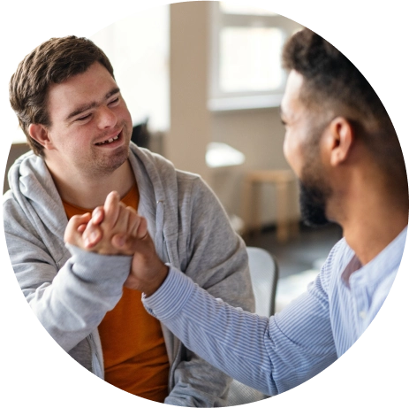 A man is shaking hands with another man.