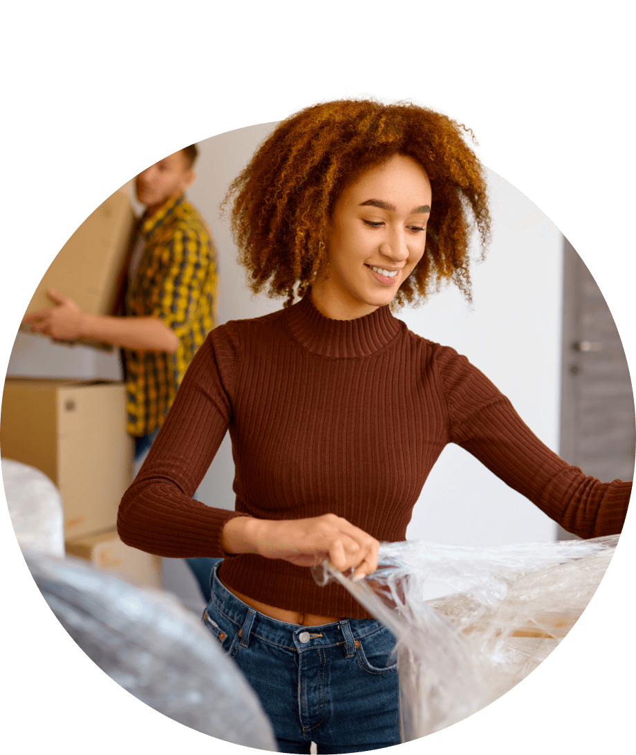 A young woman moving into a new home.