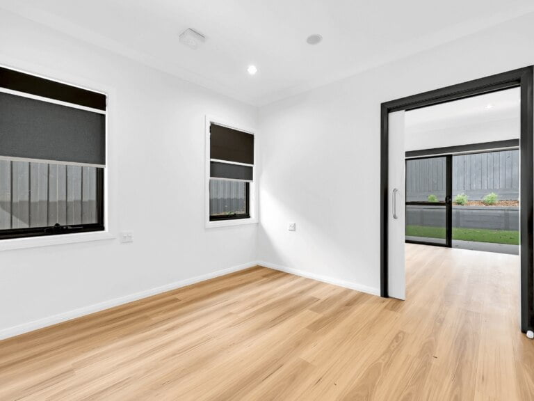 A serene, empty room with wood floors and a window in Inner West, NSW.