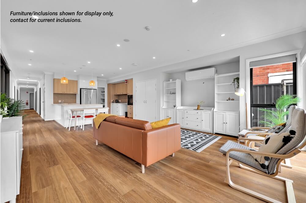 Open-plan living area in Concord 10A, Inner West Sydney, with wood flooring, brown sofa, dining table with chairs, modern kitchen, and large windows; furniture for display only as noted in corner text.