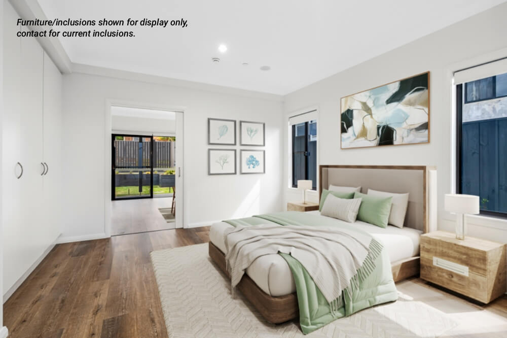 Bright, modern bedroom in Narraweena with a double bed, two bedside tables, abstract wall art, and large windows. Hardwood floors and neutral decor throughout. Text in upper left notes display furniture. Perfect Northern Beaches style living near Sydney.