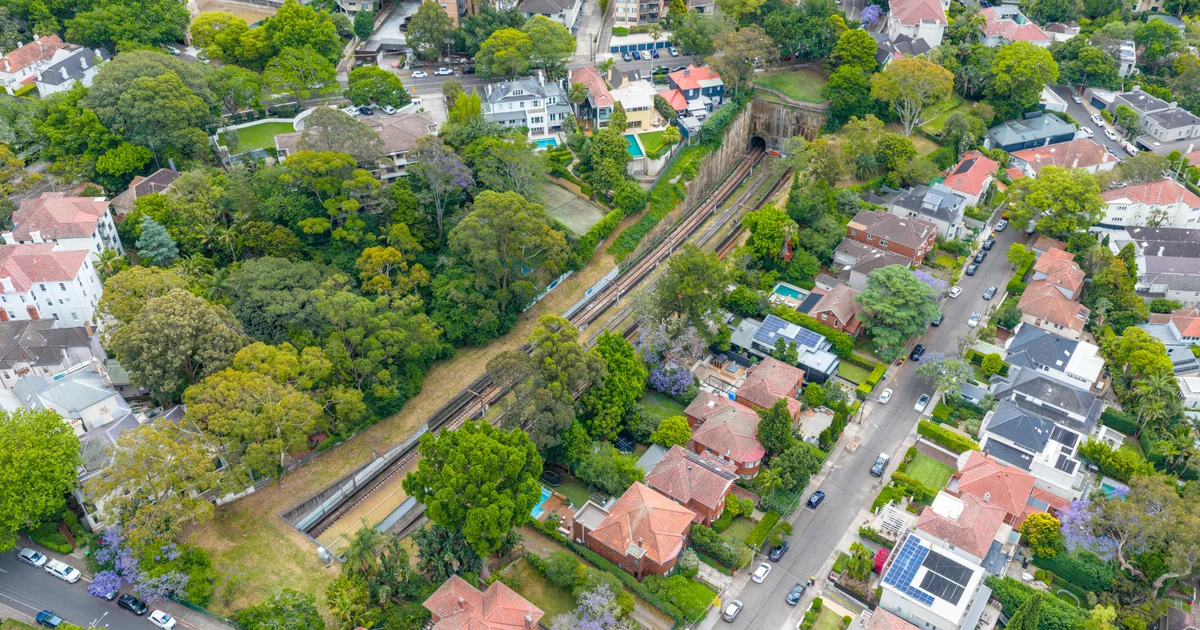 Aerial view of Sydney Inner West suburbs showing residential neighbourhoods with tree-lined streets near Concord and Burwood