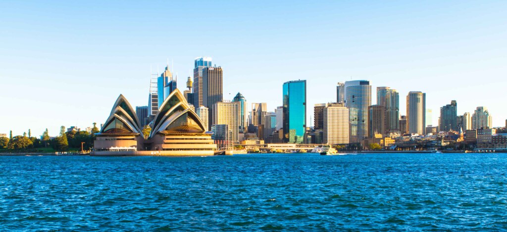 The Sydney Opera House is visible from the water.